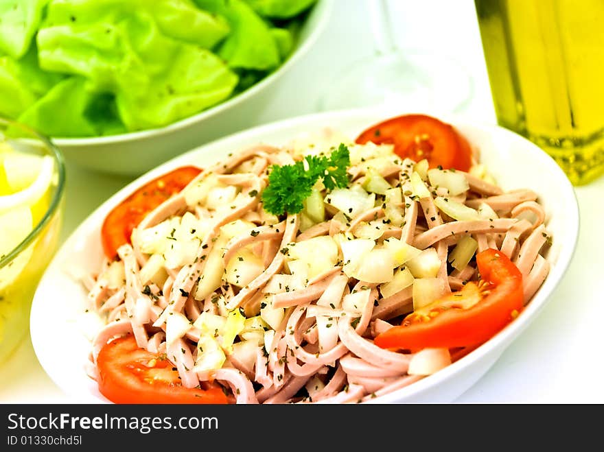 Gourmet meat salad with tomato,onion,lettuce.