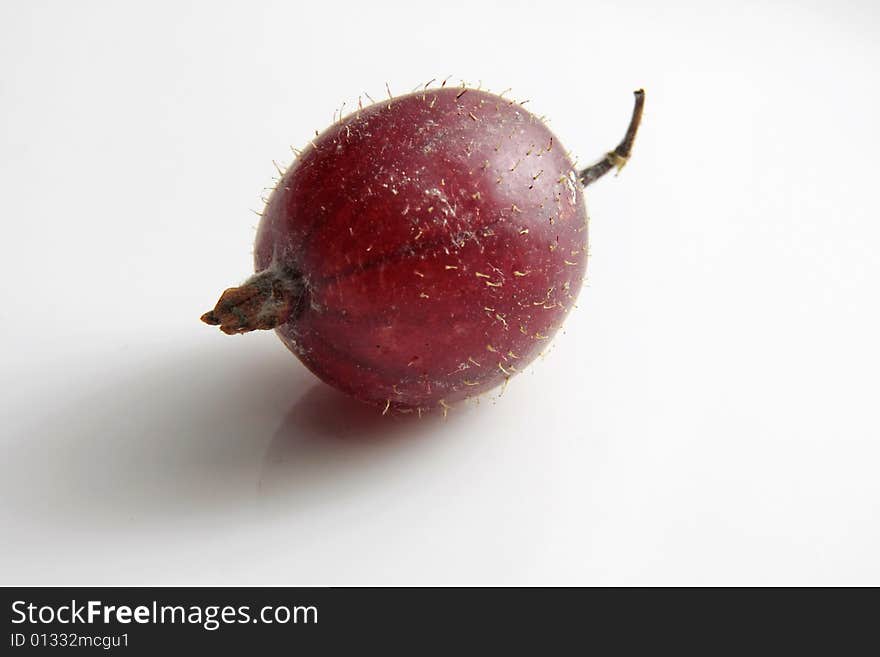 Big ripe gooseberry on a grey background