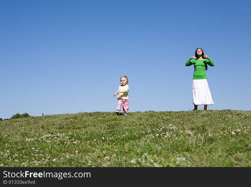 Active family on green meadow. Active family on green meadow