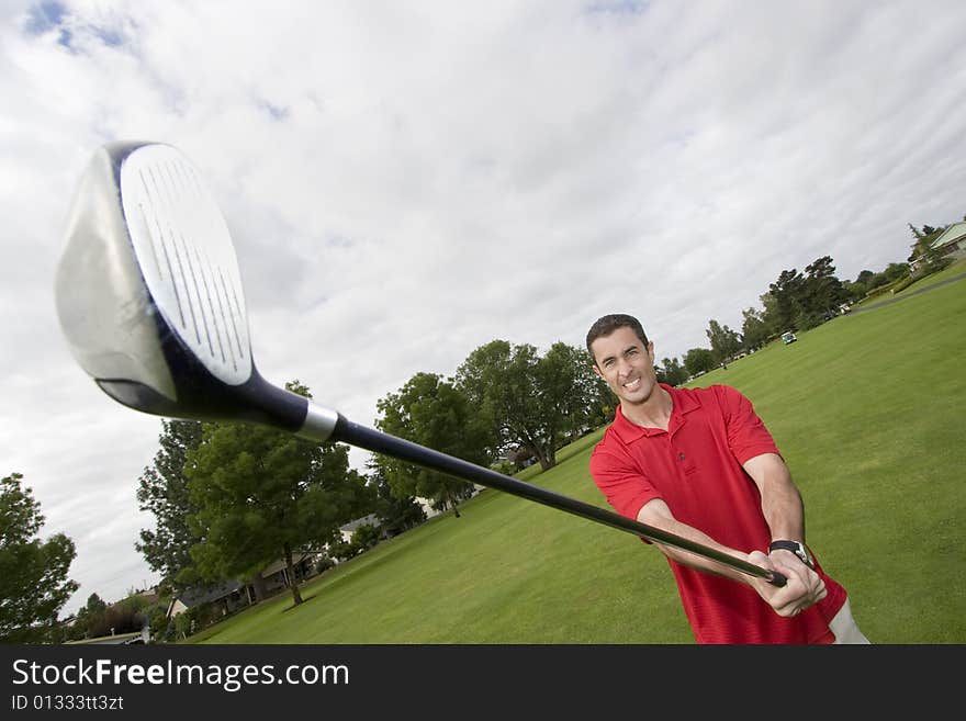 Man holding golf club. Horizontally framed photo. Man holding golf club. Horizontally framed photo.