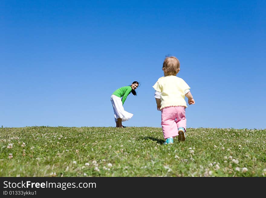 Active family on green meadow. Active family on green meadow