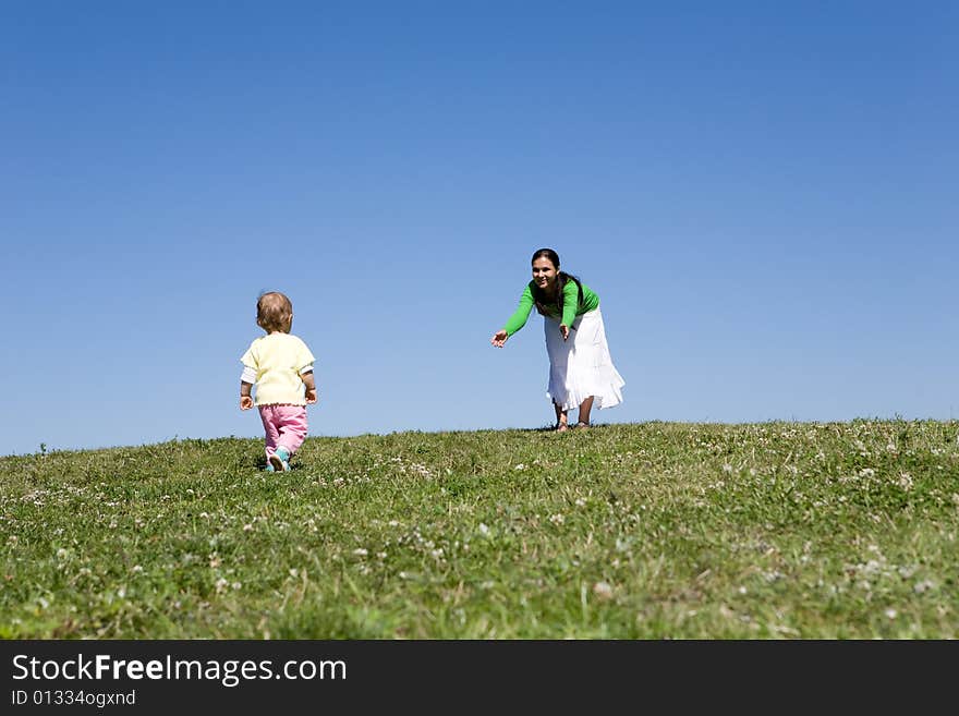 Active family on green meadow. Active family on green meadow