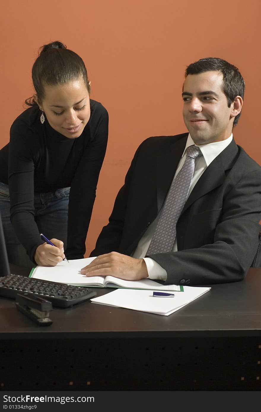 Woman Shows Businessman Paperwork - Vertical