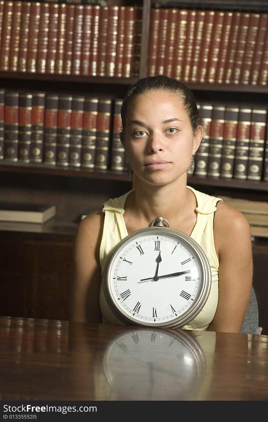 Woman Sitting Behind Clock - Vertical