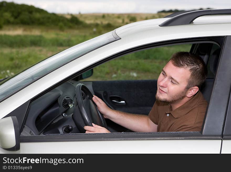 Casual man traveling by car. Casual man traveling by car