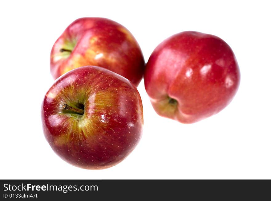 Three apples on a white background