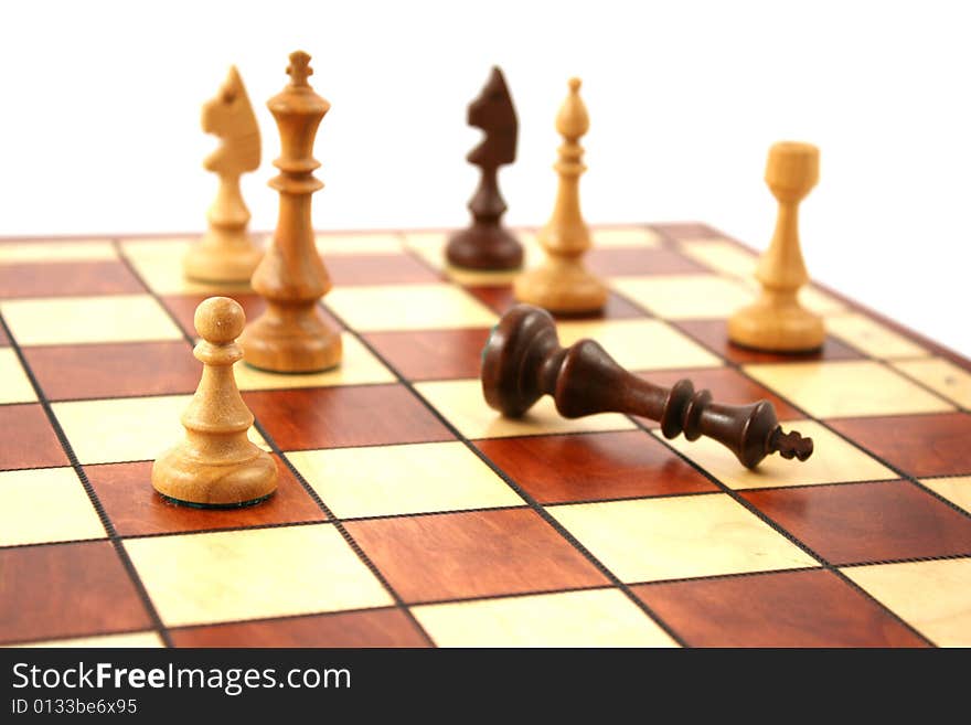 Wooden chess on wooden chessboard in studio