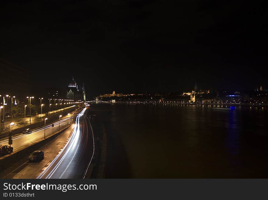 A view of the Pest bank in Budapest at night, from the Margaret Bridge. The Chain bridge is also visible. A view of the Pest bank in Budapest at night, from the Margaret Bridge. The Chain bridge is also visible