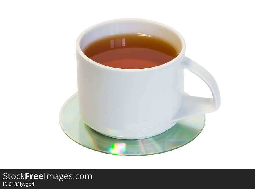 Cup of tea on CD, isolated on white background