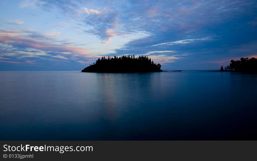 An island of the shore of Lake Superior in blue. An island of the shore of Lake Superior in blue