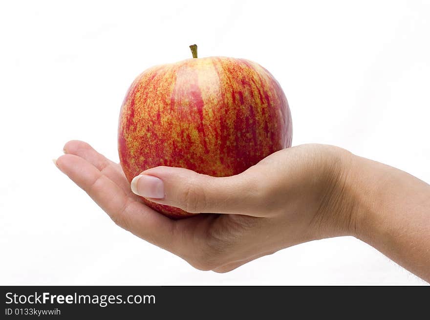 Apple on the hand, white background