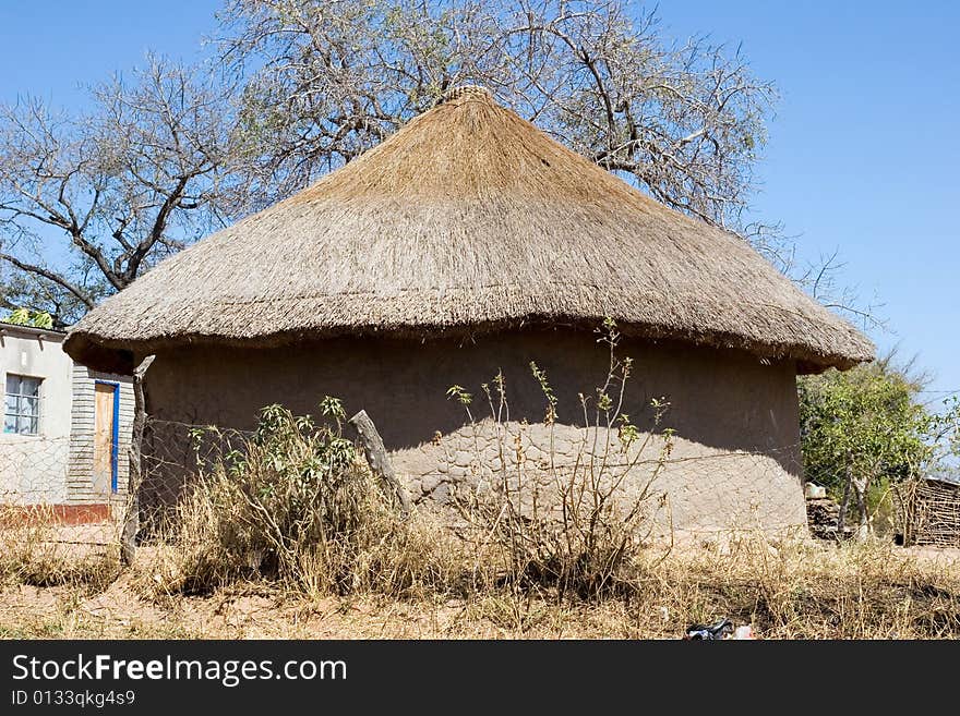 Just off the big cities of south africa there is landscape, hut in the old style of the african tribes. Just off the big cities of south africa there is landscape, hut in the old style of the african tribes