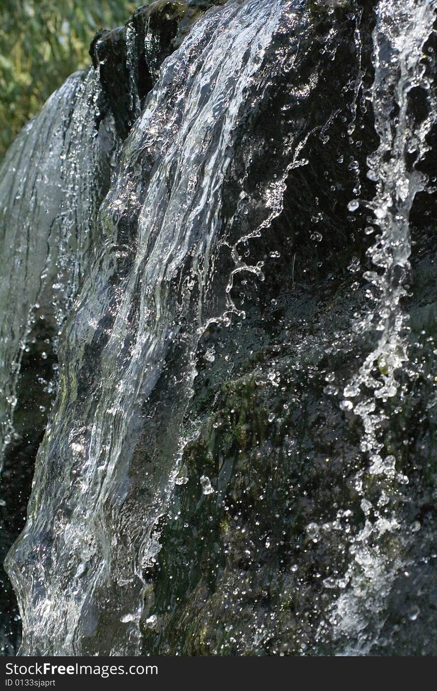 close up to water cascade with splashes and drops