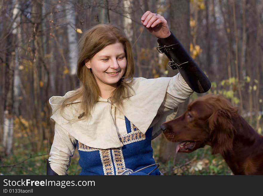 Portrait of the girl and irish setter in autumn forest. Portrait of the girl and irish setter in autumn forest.