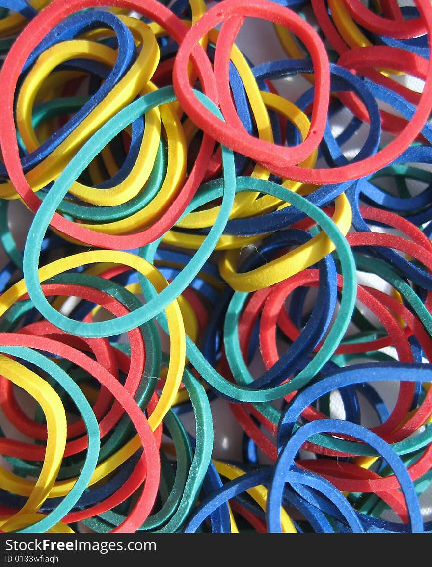 Primary colors rubber band background. Primary colors rubber band background