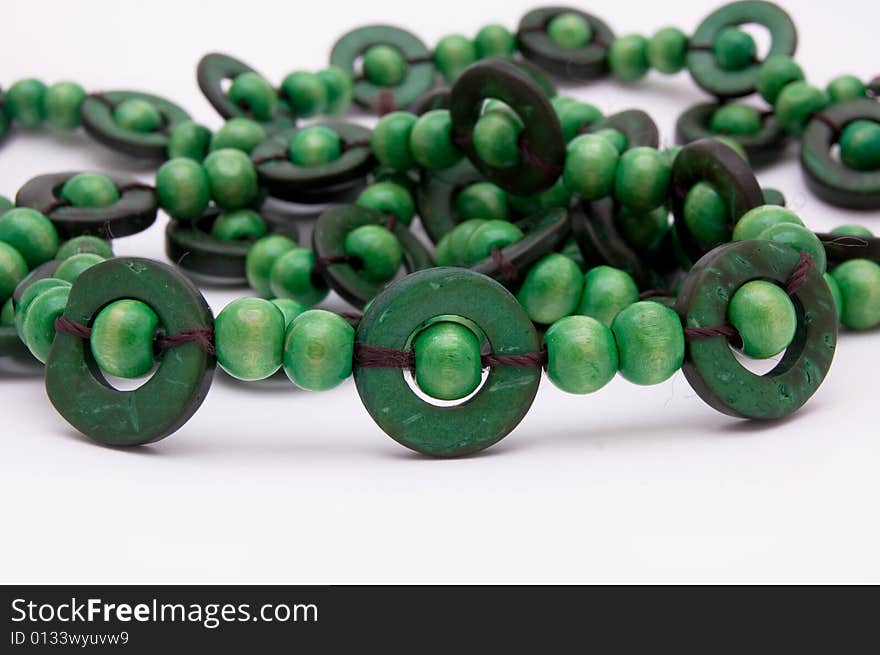 Green jewelry isolated on white