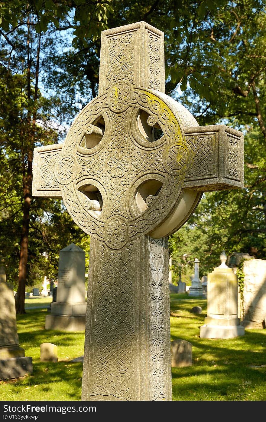 Celtic cross tombstone in cemetery