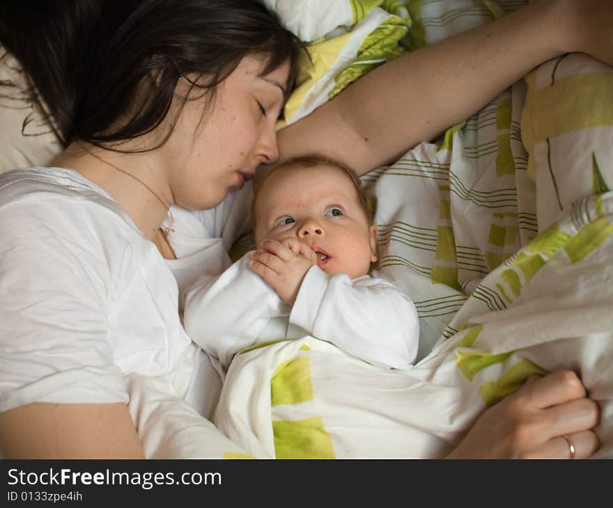 Baby with mom in the bed. Baby with mom in the bed