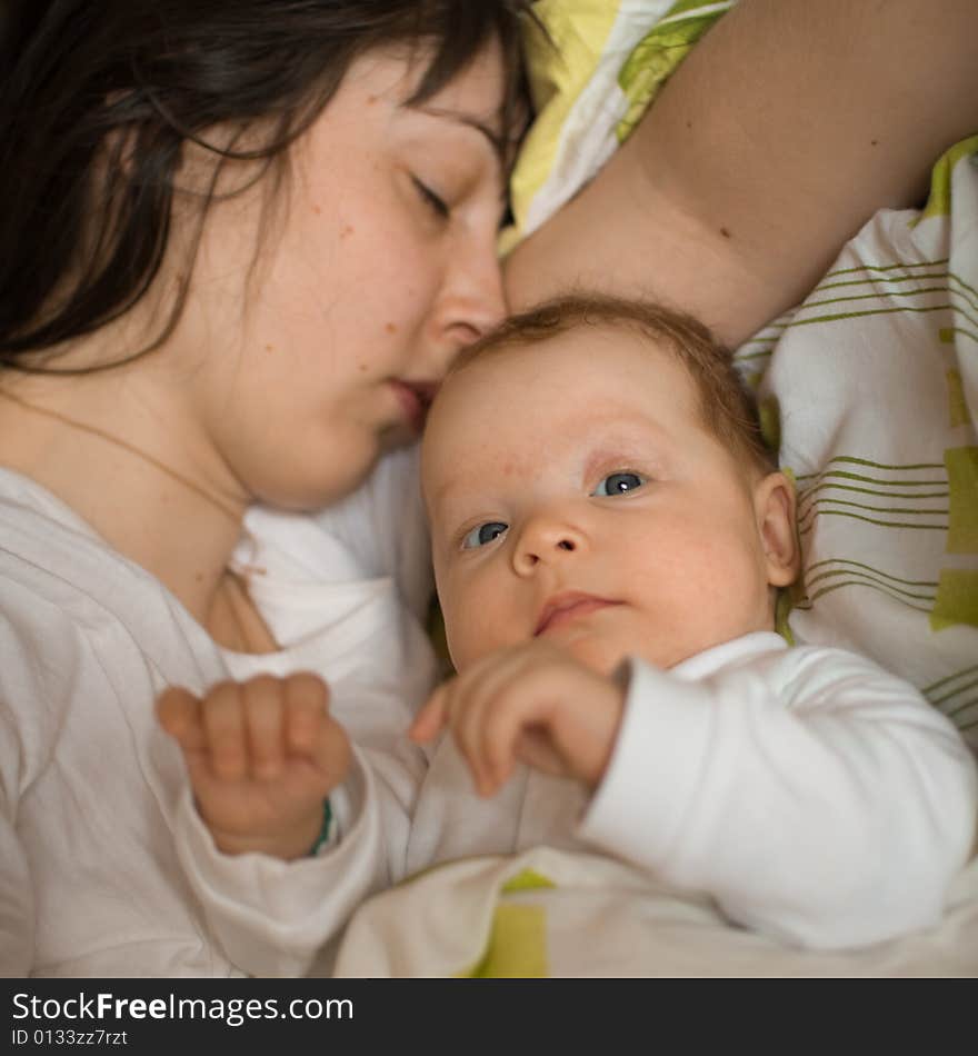 Baby with mom in the bed. Baby with mom in the bed