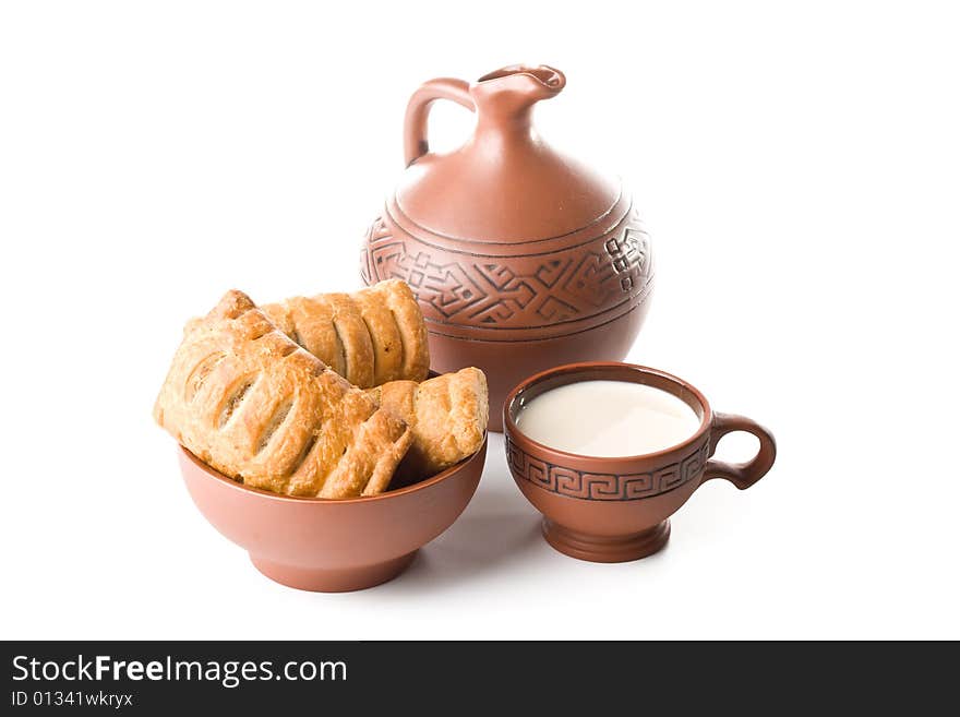 Pie, jug and cup of milk