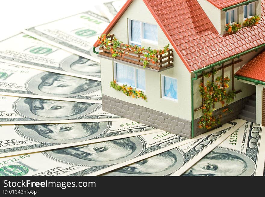 Miniature House and Money. Buying house concept