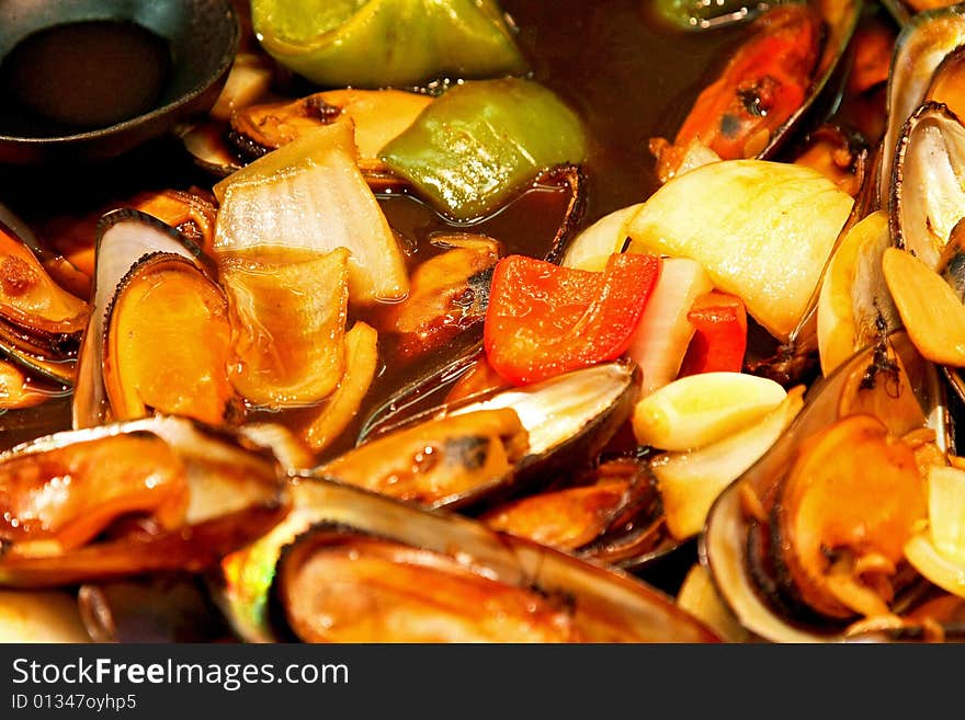 Mussels in sauce with lot of vegetables