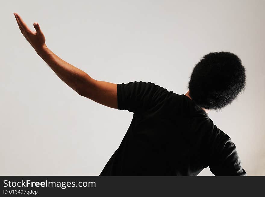 Back Portrait of young african man with open arm. Back Portrait of young african man with open arm