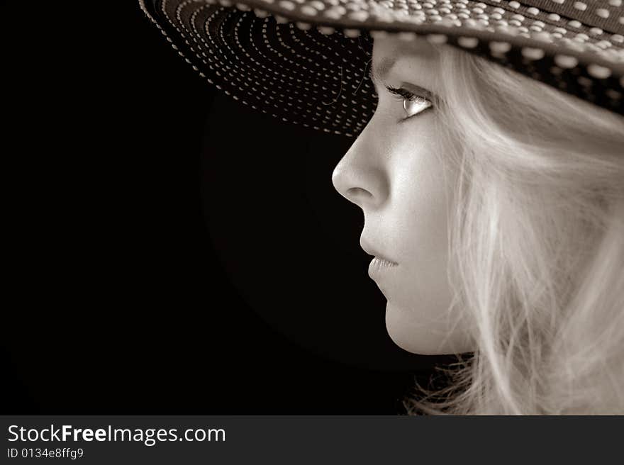 Beautiful Image of a woman in a hat On Black. Beautiful Image of a woman in a hat On Black