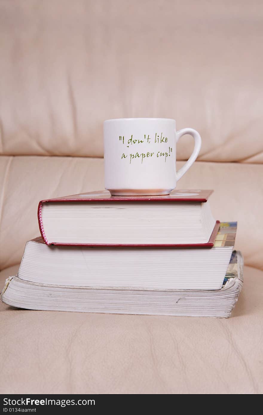 A cup of coffee on book