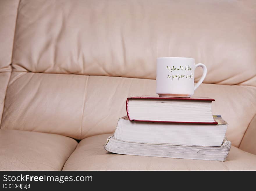 A cup of coffee on book