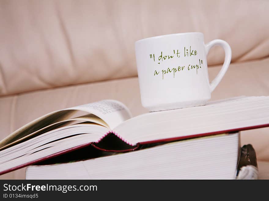 A cup of coffee on book