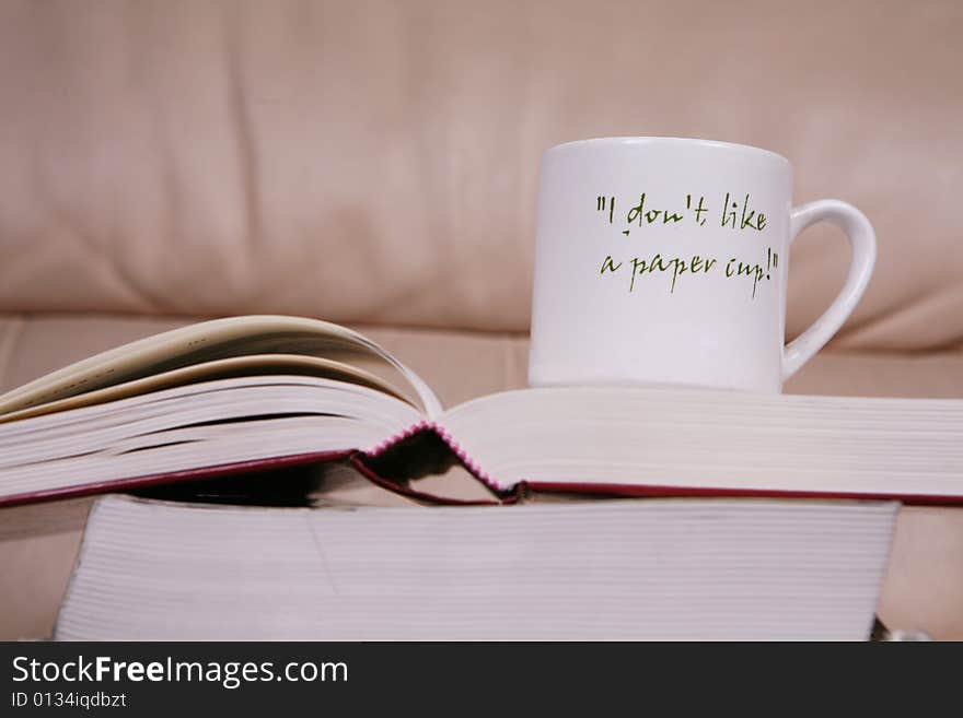 Cup of coffee on book