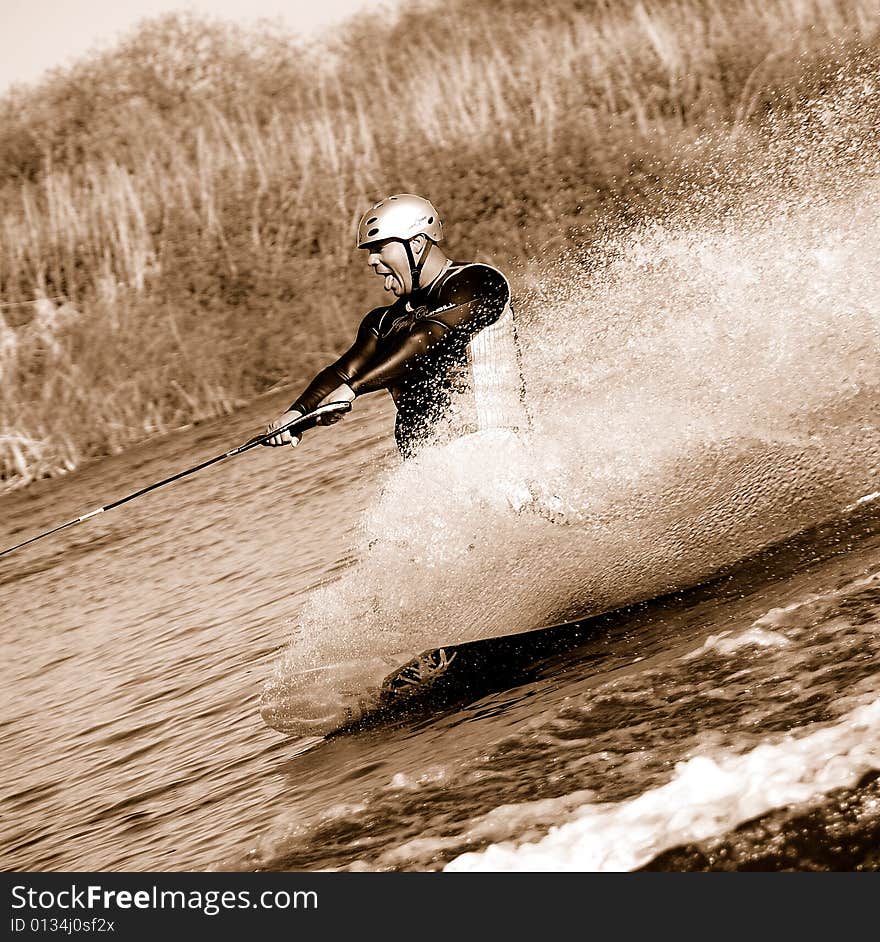 Tongue out while practicing on a Wakeboard. Tongue out while practicing on a Wakeboard