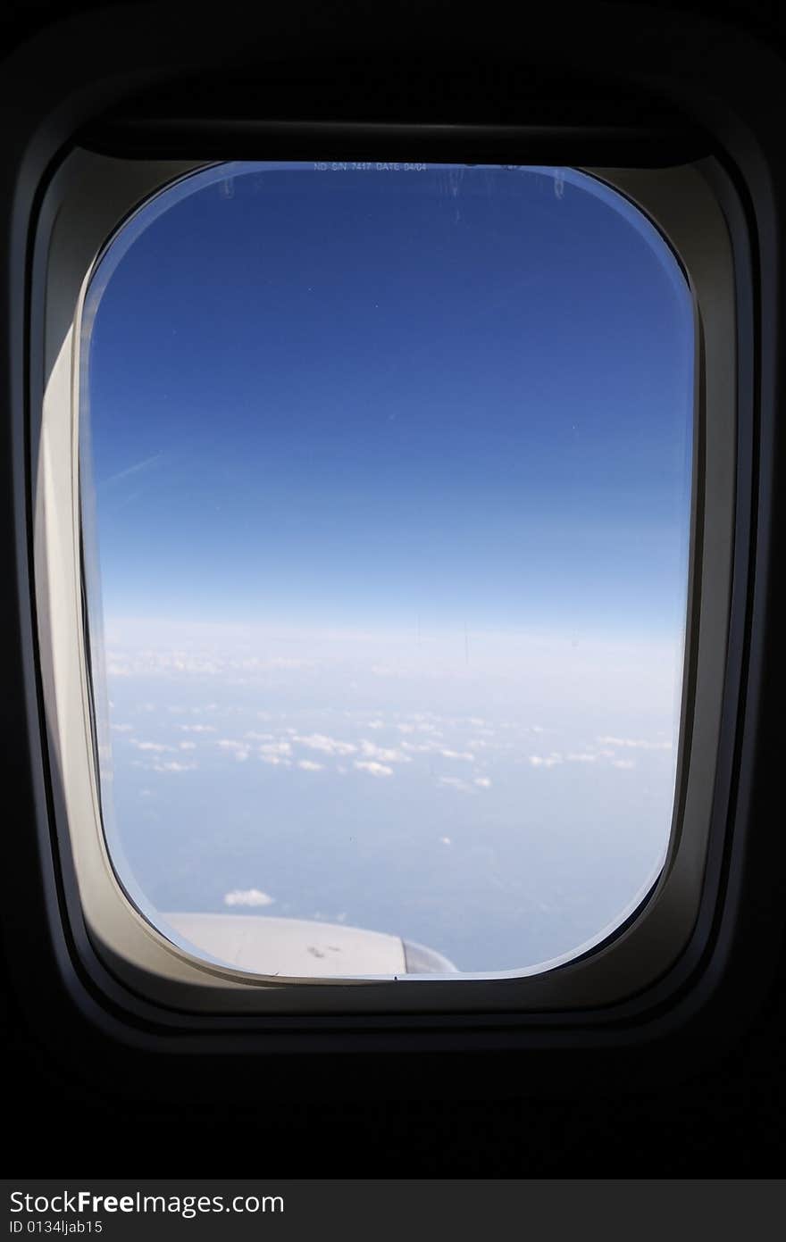 Sky and clouds seen through an airplane's window. Sky and clouds seen through an airplane's window