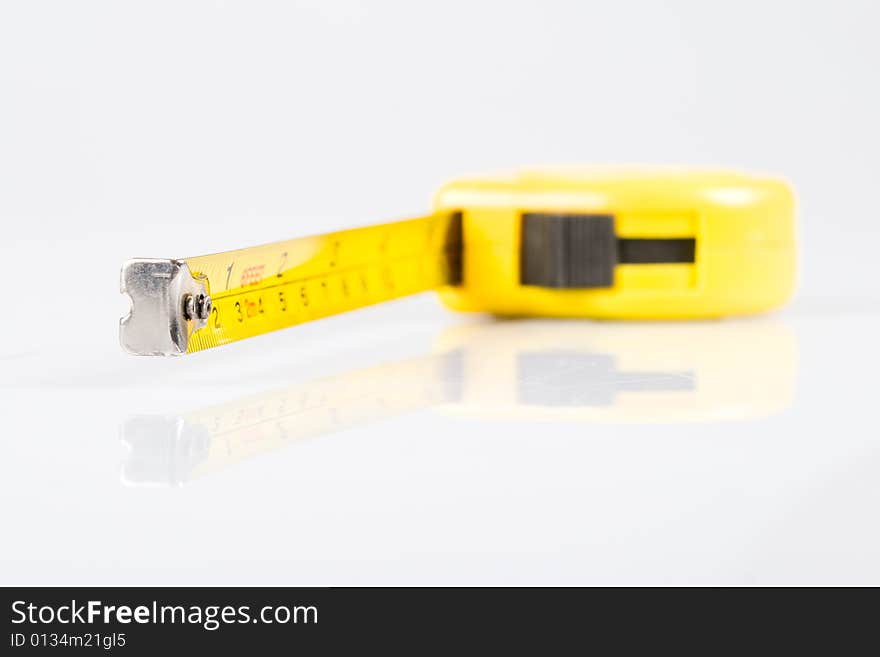 Yellow ruler isolated on white background