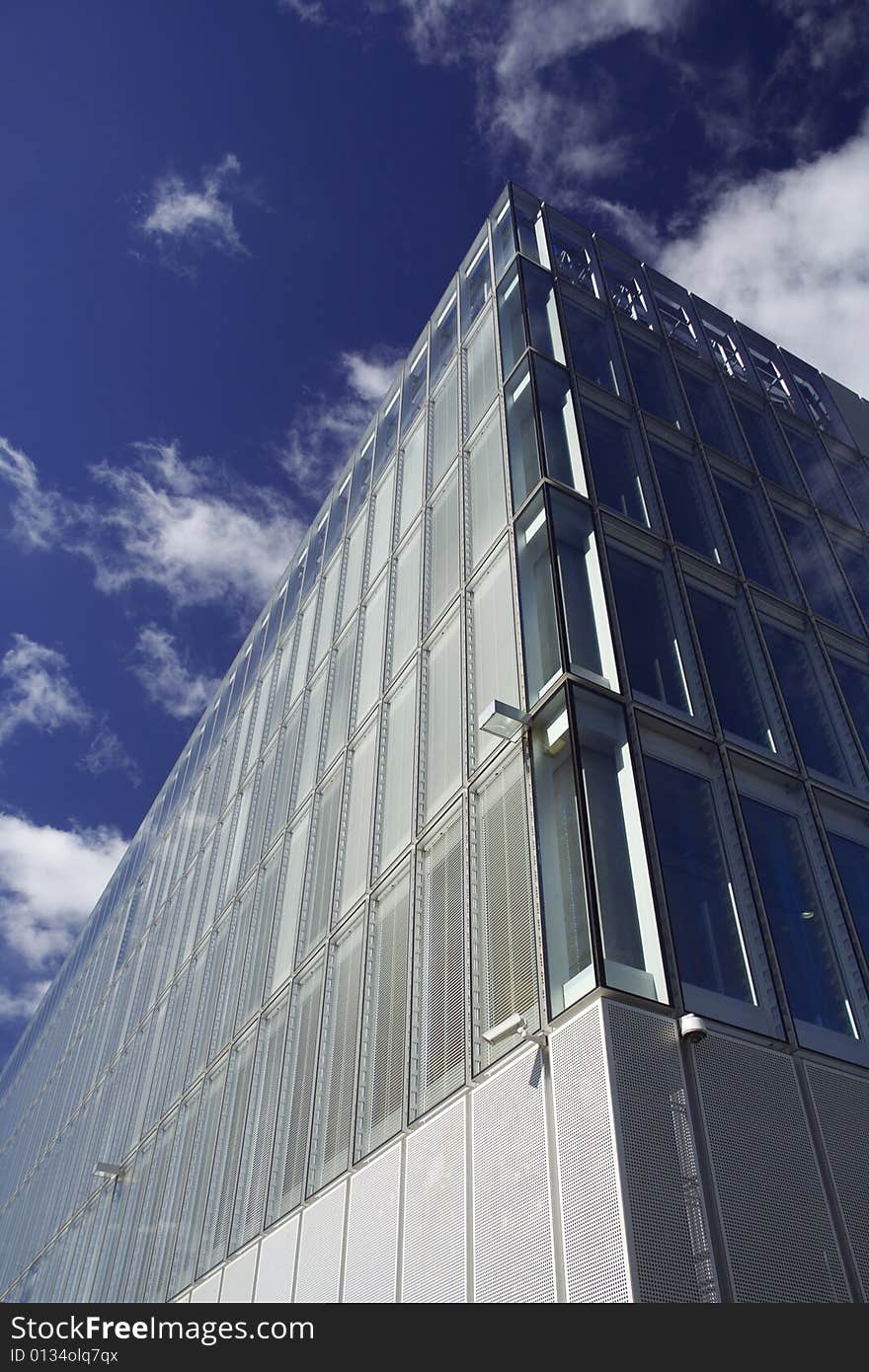 Modern corporate glass-fronted building in sunshine. Modern corporate glass-fronted building in sunshine