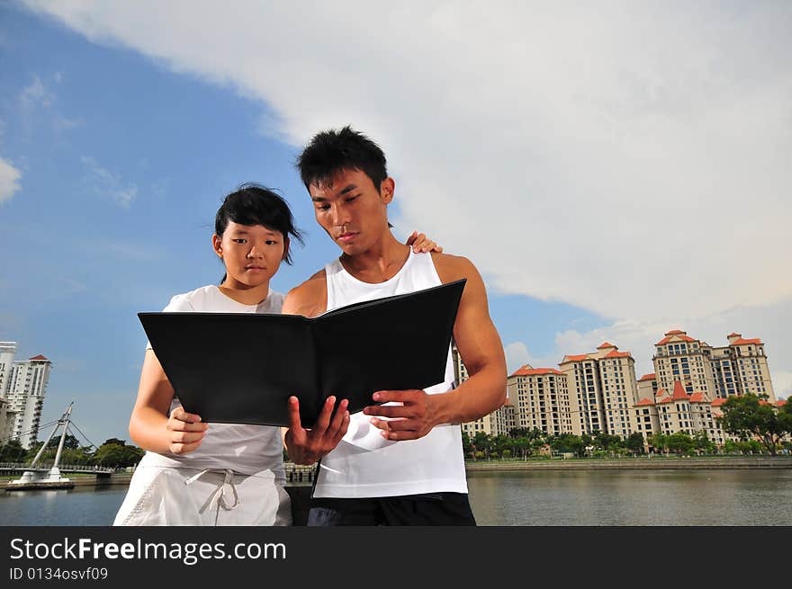 Picture of an urban couple making decisions. Picture of an urban couple making decisions.