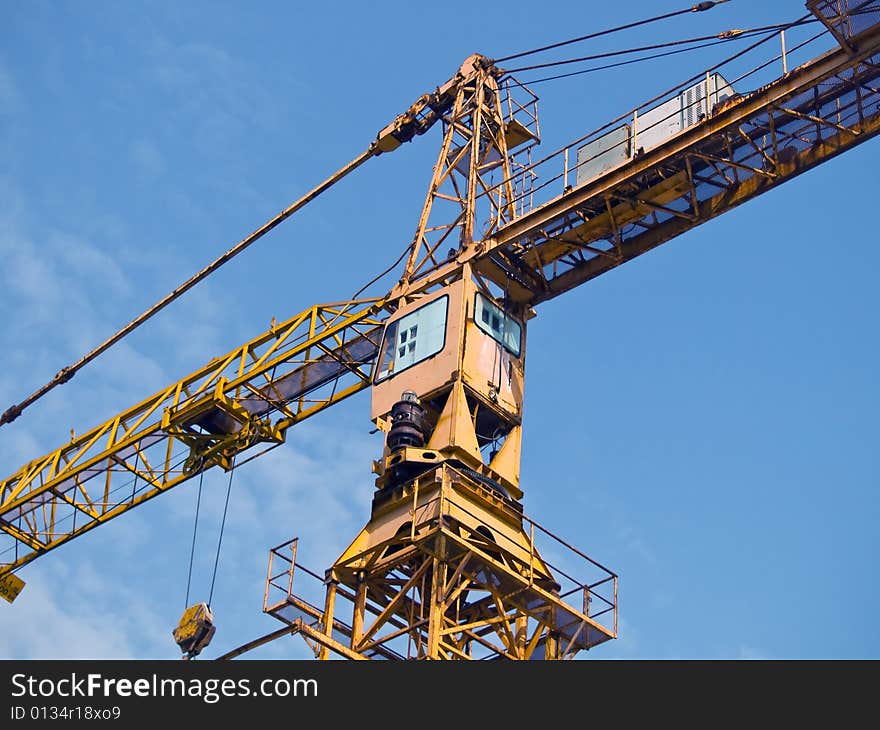 Construction site crane with view on a cabin. Construction site crane with view on a cabin