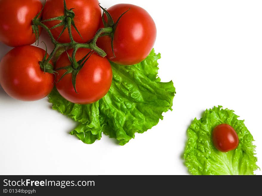 Big and cherry tomatoes on paper