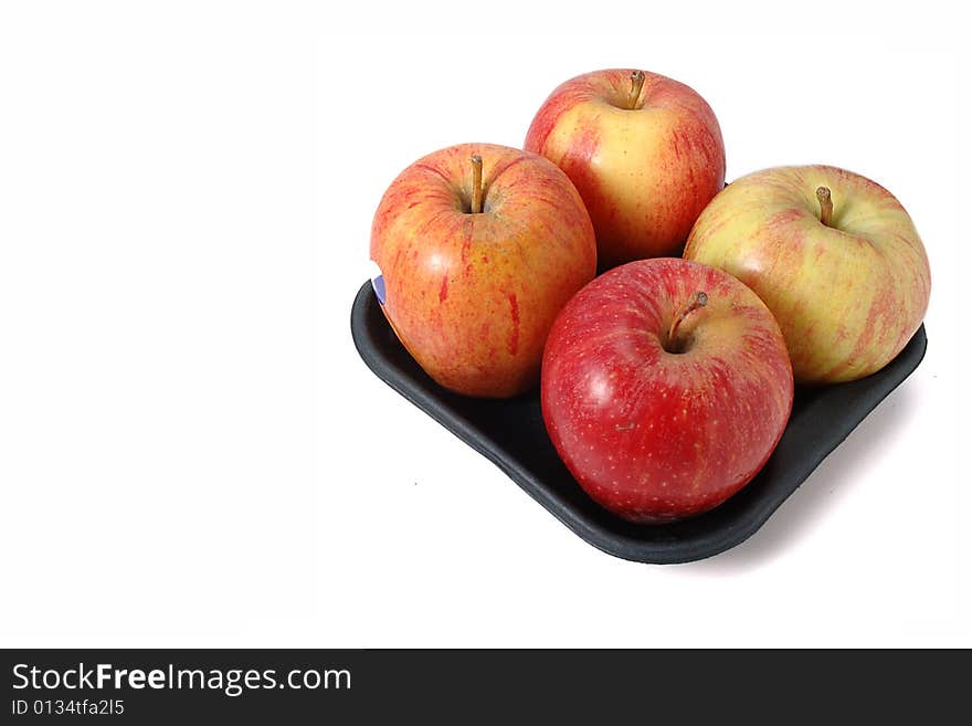 Fresh red apples brightly lit on isolated white background