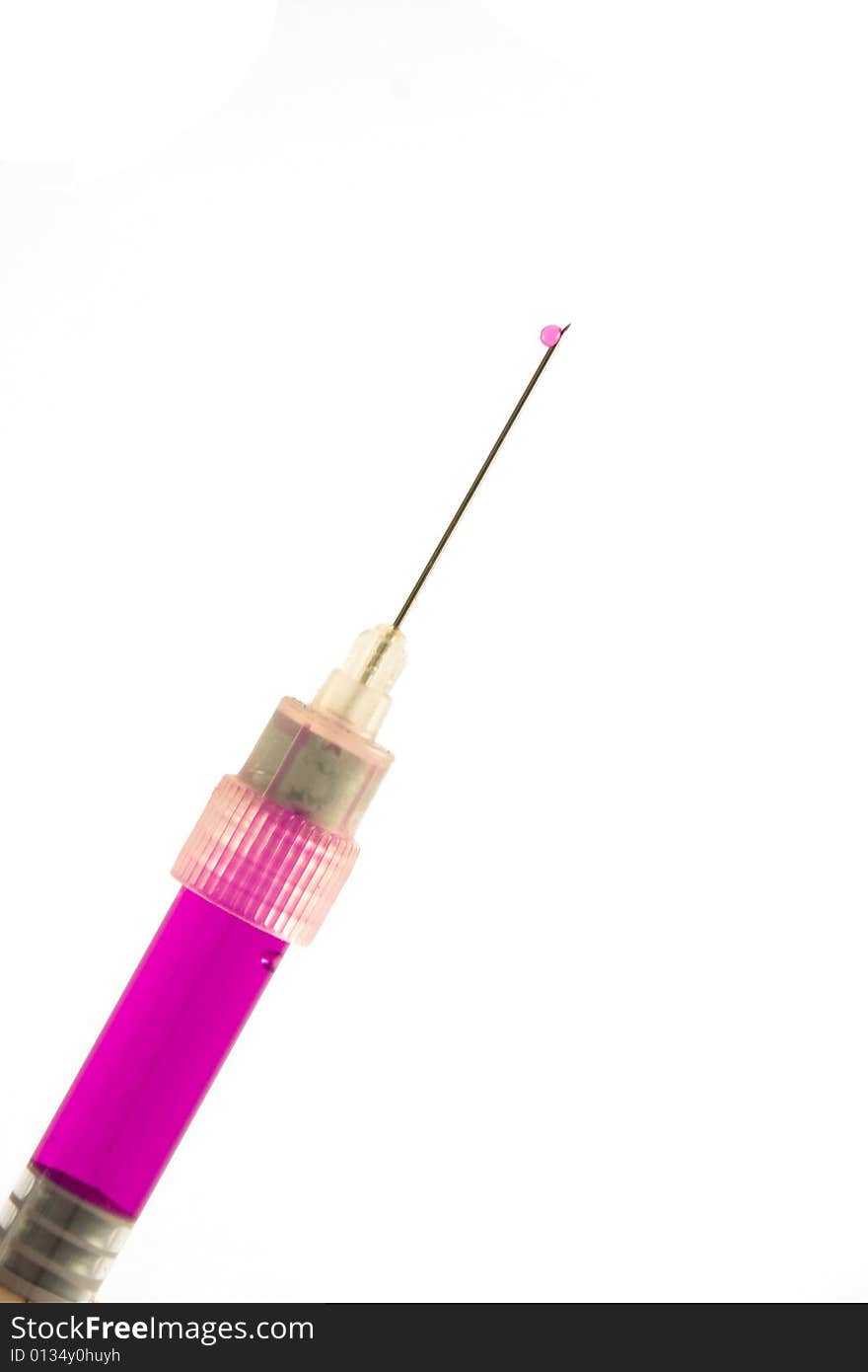 Syringe filled with the pink liquid