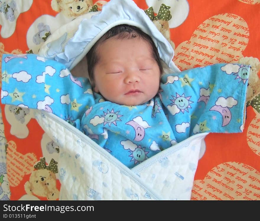 Sleeping Baby on a bed