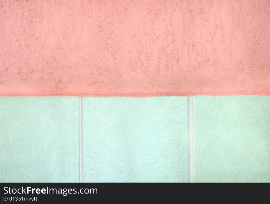 Pink stucco and light green tiled wall. Pink stucco and light green tiled wall.