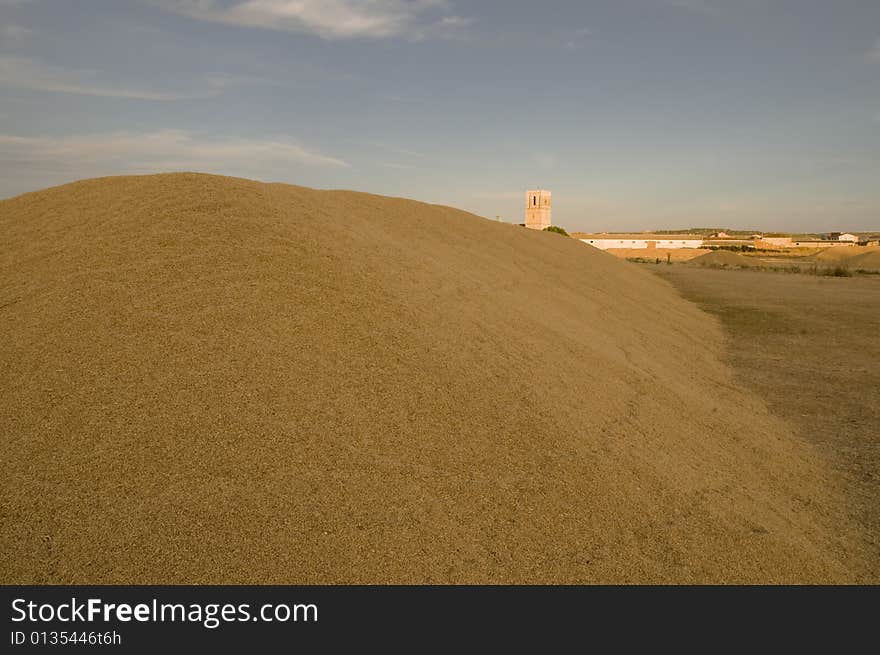 Description:
After collecting the graing, farmers pile it on the ground. They form a huge \mountains\. From this place (called \era\ in spanish), where they threshed the grain many years ago, carry it to stores. The shot was taken when the sun was very low. The light is quite red. In the background it can be seen the Church of the village (Villabrágima - Valladolid - Spain). Description:
After collecting the graing, farmers pile it on the ground. They form a huge \mountains\. From this place (called \era\ in spanish), where they threshed the grain many years ago, carry it to stores. The shot was taken when the sun was very low. The light is quite red. In the background it can be seen the Church of the village (Villabrágima - Valladolid - Spain)