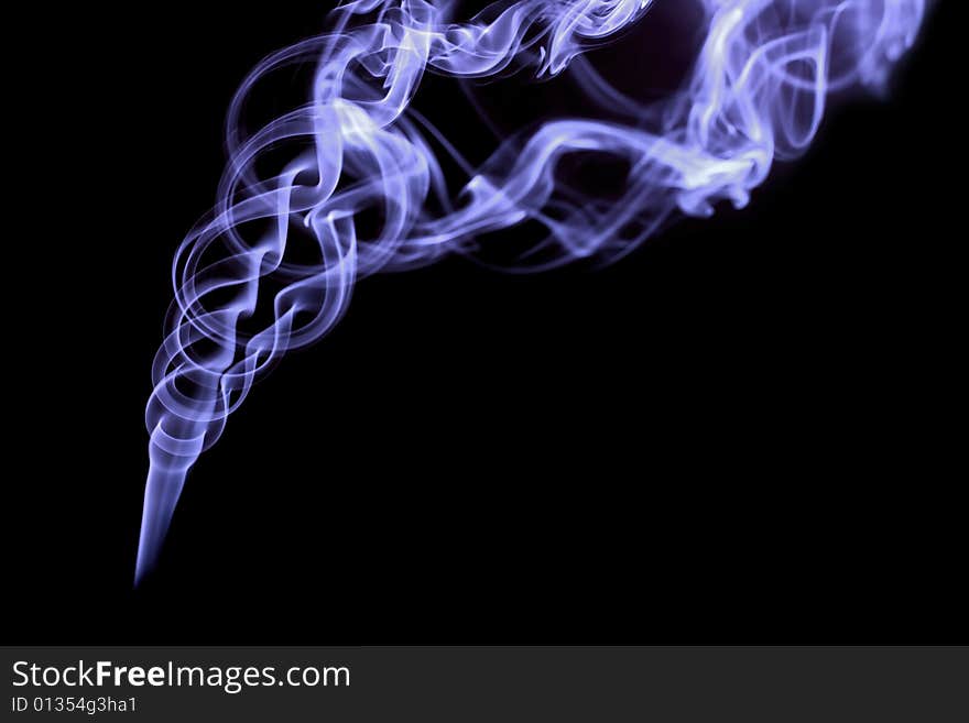 Blue smoke on black background