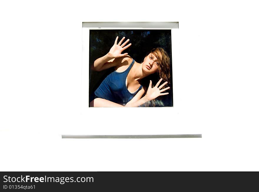 Young woman looking through the window, white background. Young woman looking through the window, white background