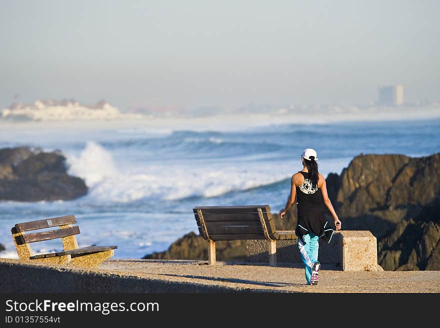 Fit Young Lady Walking Next To Beach