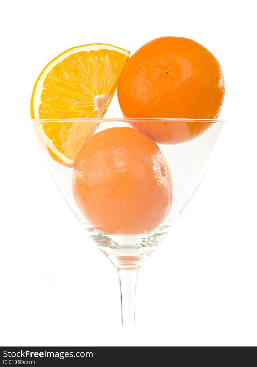 Mandarins in glass isolated on white background