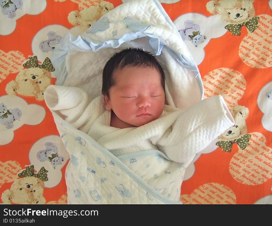 Sleeping Baby on a bed