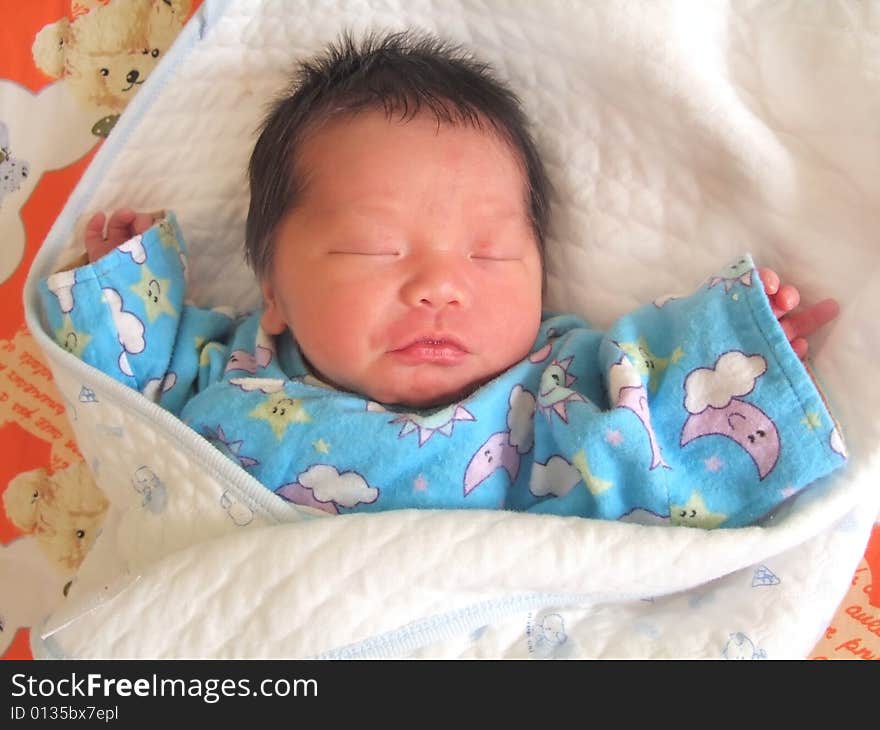 Sleeping Baby on a bed